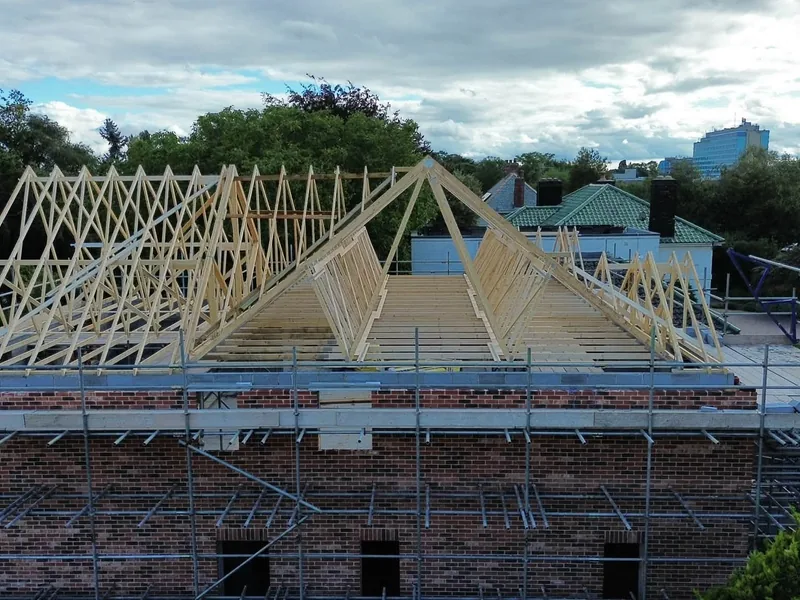 Front of the Boston house under scaffold with the 40 degree trusses in place