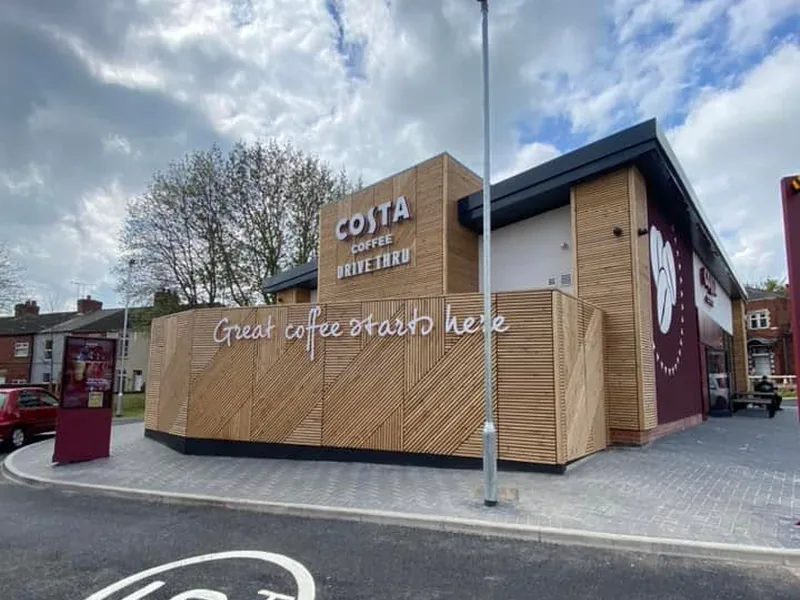 Completed Costa drive-thru unit with timber cladding and brand signage