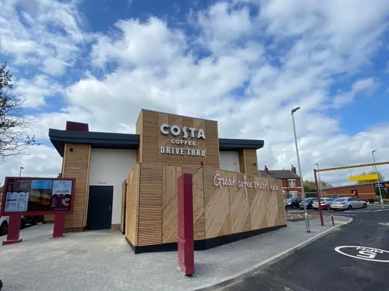 Completed Costa Coffee drive-thru with timber cladding, menu board and drive-thru lane