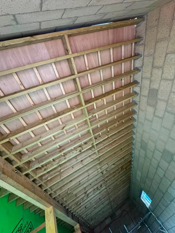 Underside of the cycle store roof structure, looking along its length