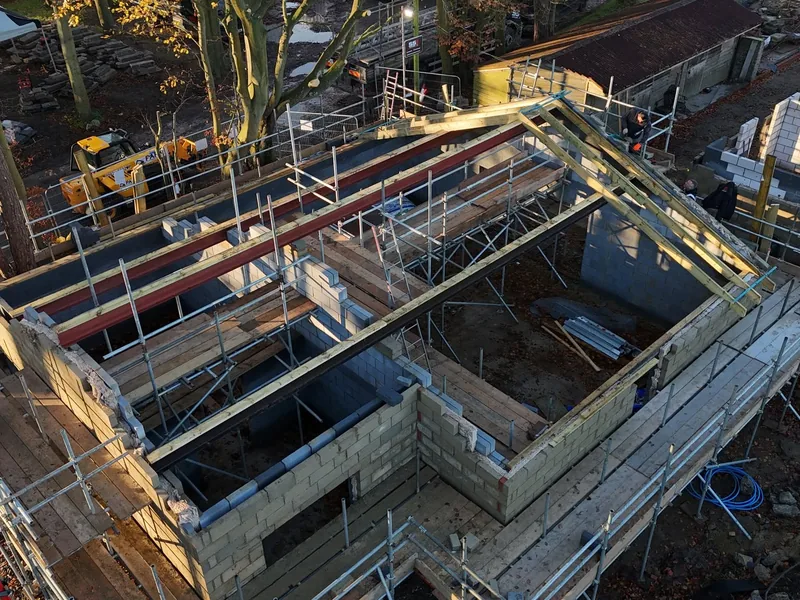 Aerial view of blockwork walls with steel beams and new timber wall plates