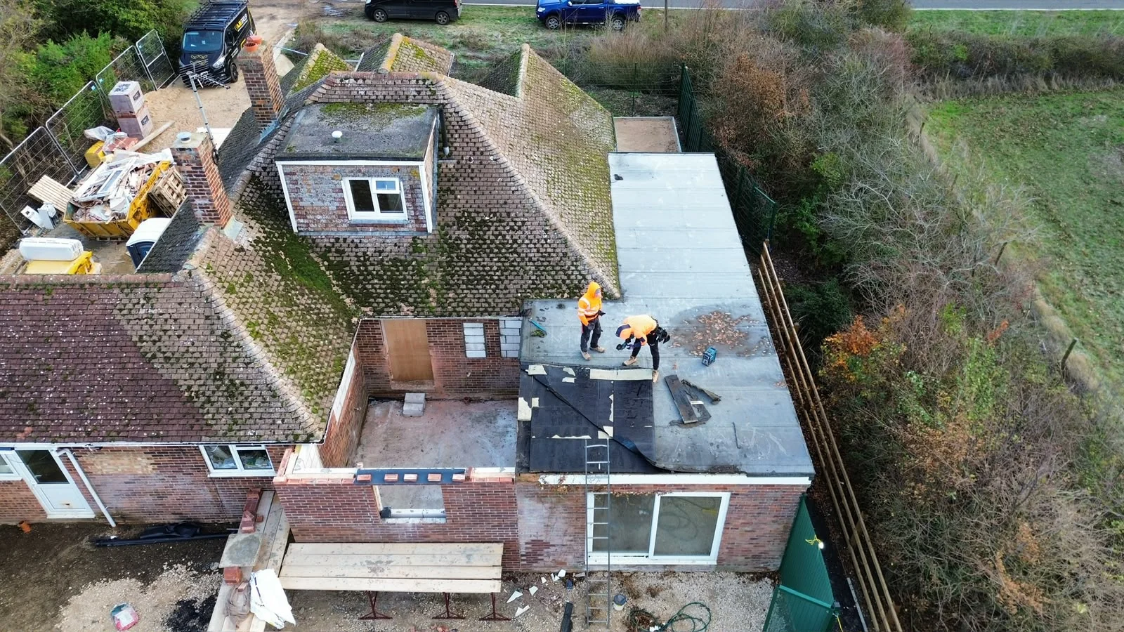 Aerial view of the flat roof works and rear extension in progress at Four Winds, Ramsey