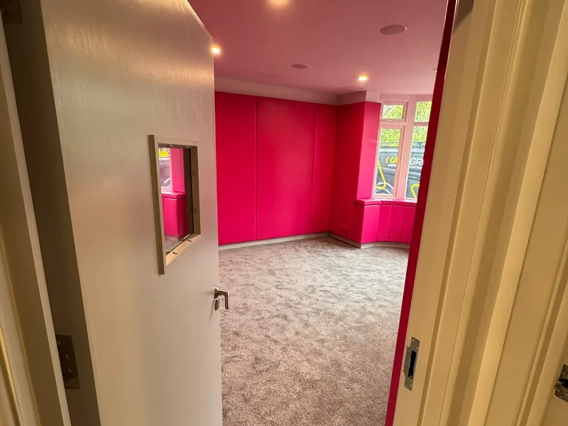 Completed corridor with feature colour joinery and new doors at the Ramsey facility