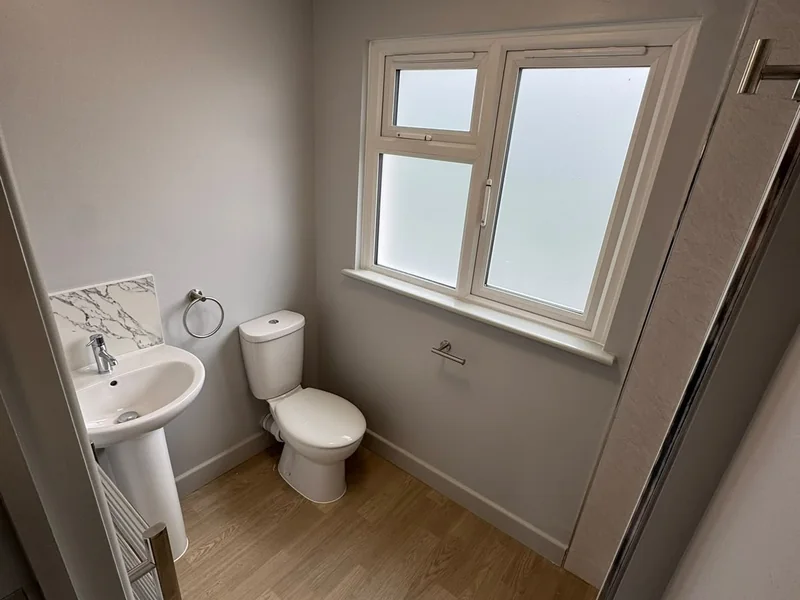 Completed bathroom with new sanitaryware and flooring