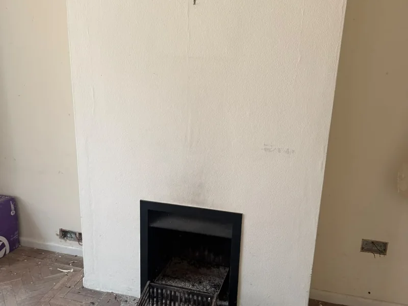 Original chimney breast and fireplace before removal