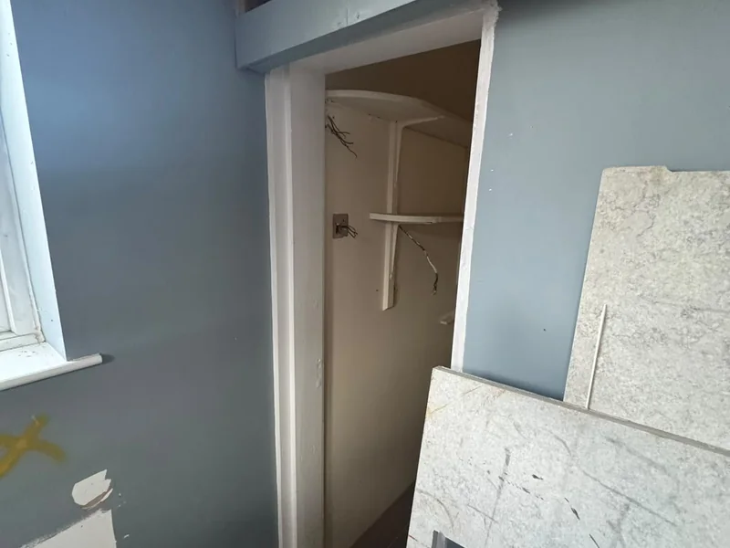Plasterboard stacked in a stripped room during the Ramsey conversion