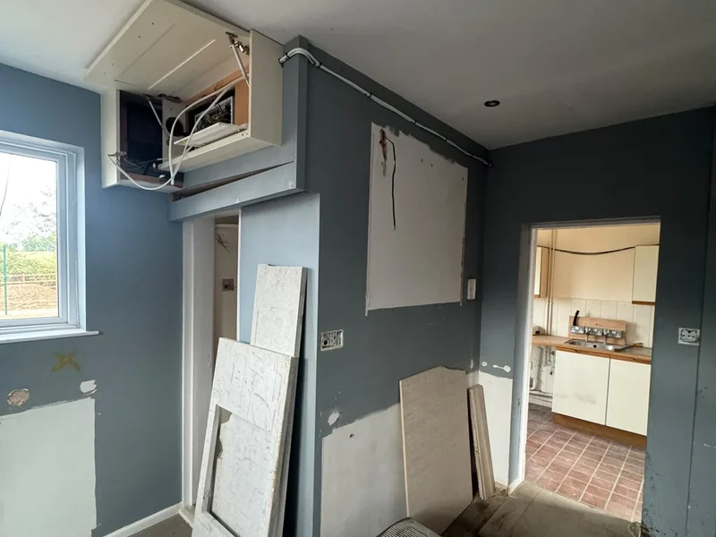 Doors removed and materials staged during the internal refit