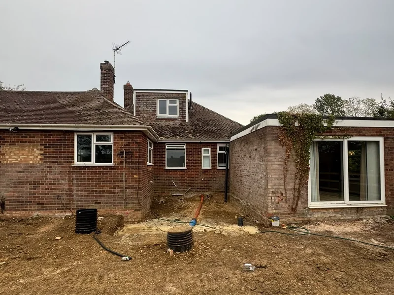 Rear elevation of the bungalow with ground works under way