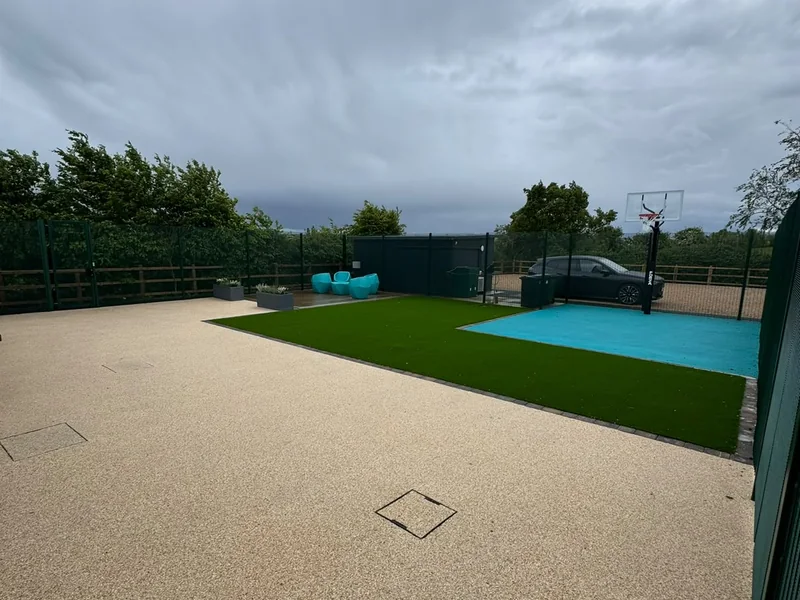 Completed resin bound terrace and sports court to the rear