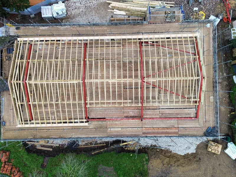 Hand cut roof structure with ridge, common rafters and valley sets set out by AJB Group carpenters