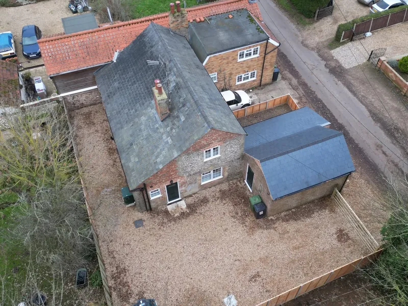 Aerial view of completed tiled roofs and an outbuilding