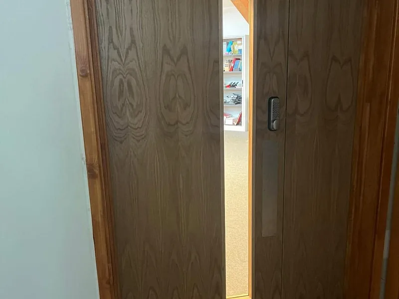 Internal fire door set and frame installed in an apartment