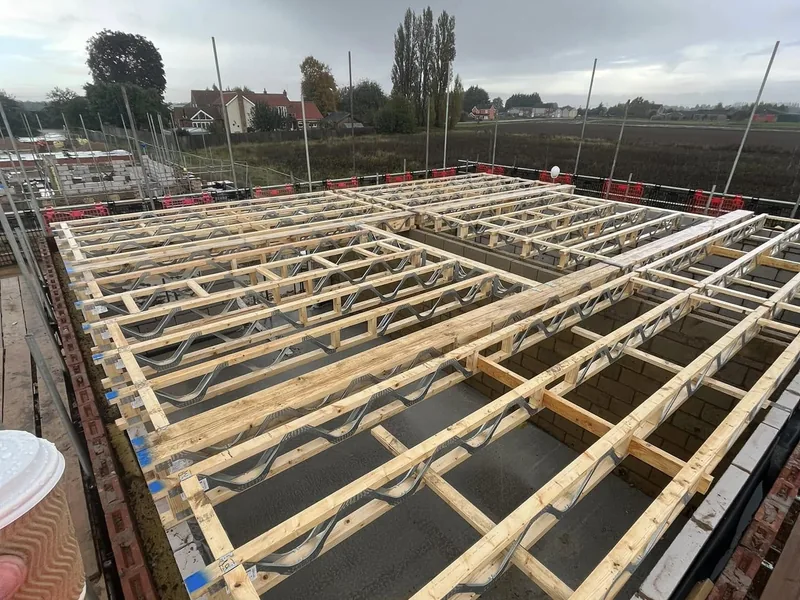 Traditional joist set being installed