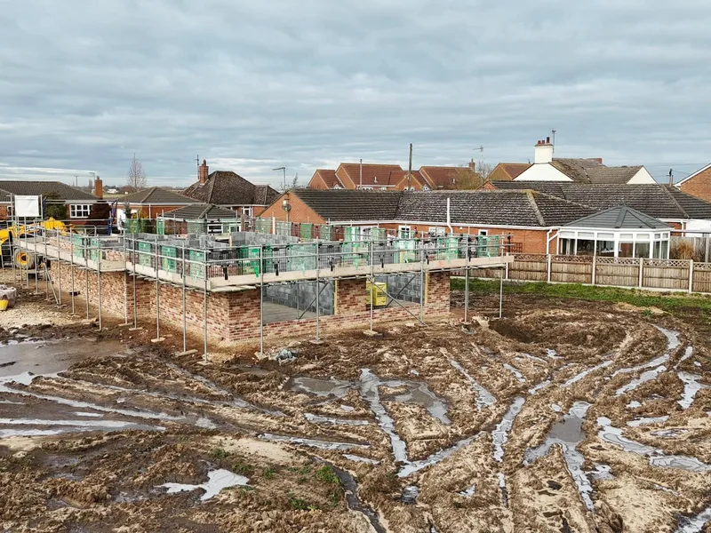 New build plots under scaffold on a housing development