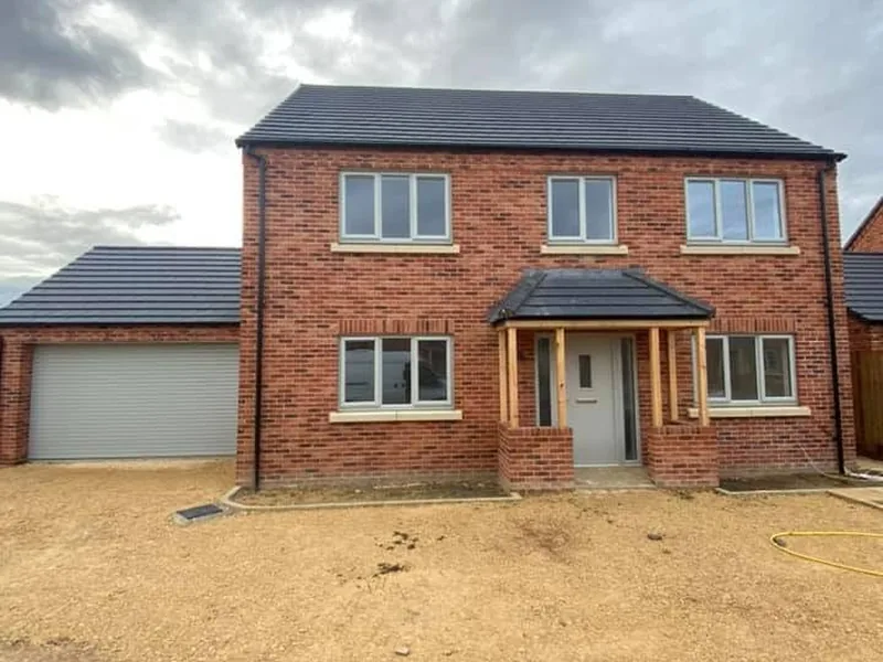 New build detached house with an oak framed porch
