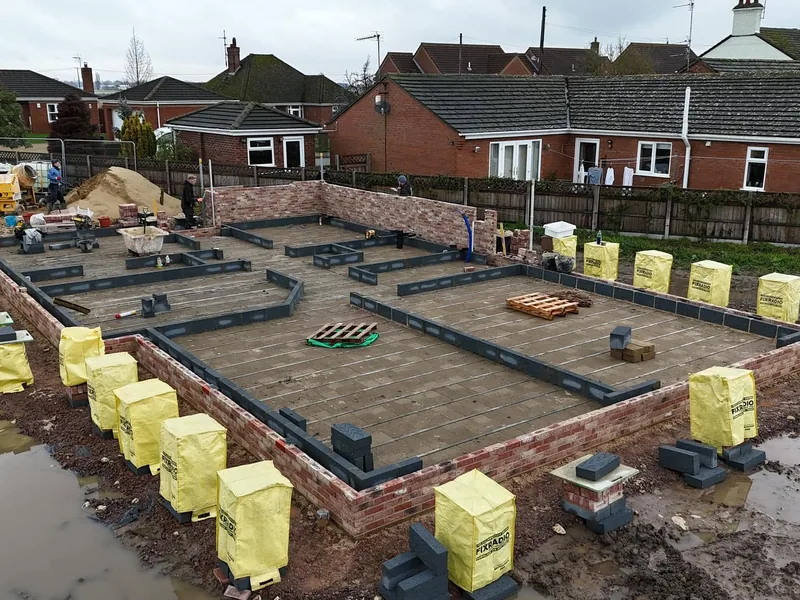Beam and block ground floor completed over new foundations with blockwork walls set out