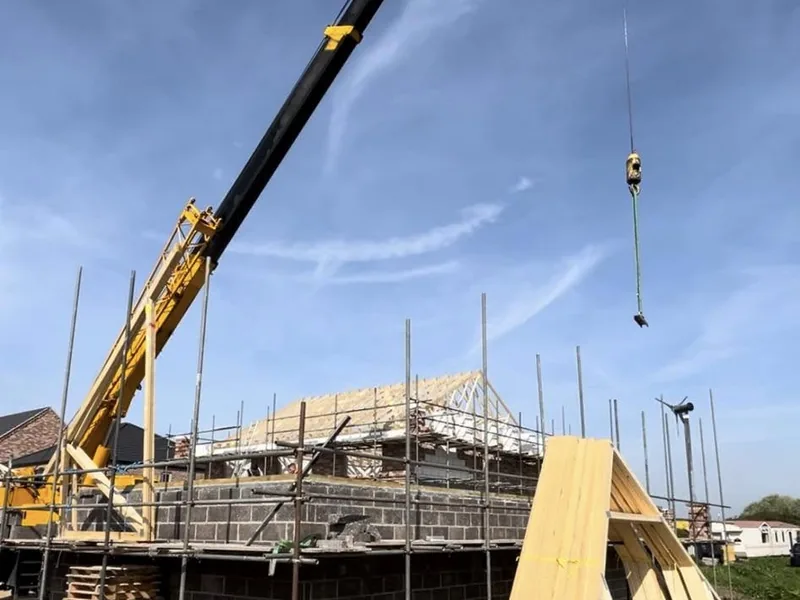 Hip roof structure built by AJB Group carpenters