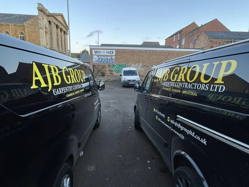 Branded AJB Group vans on site