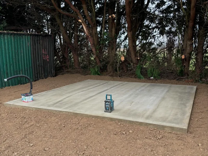 Finished concrete slab base laid on a cleared site ready for building work